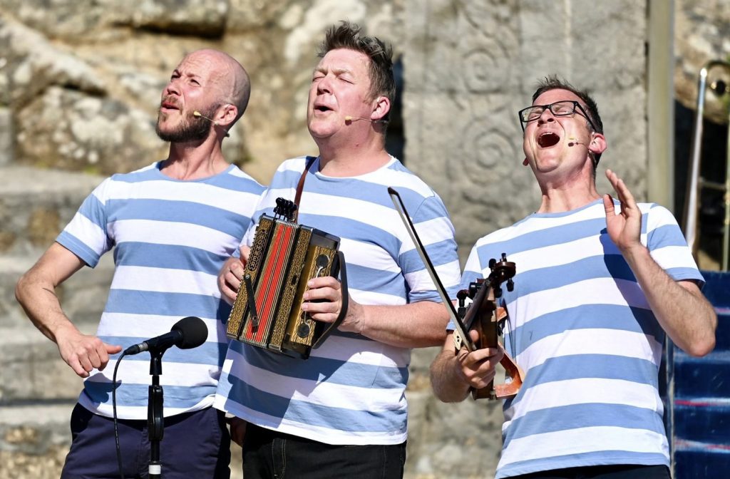 Performers singing for Songs For Explorers show