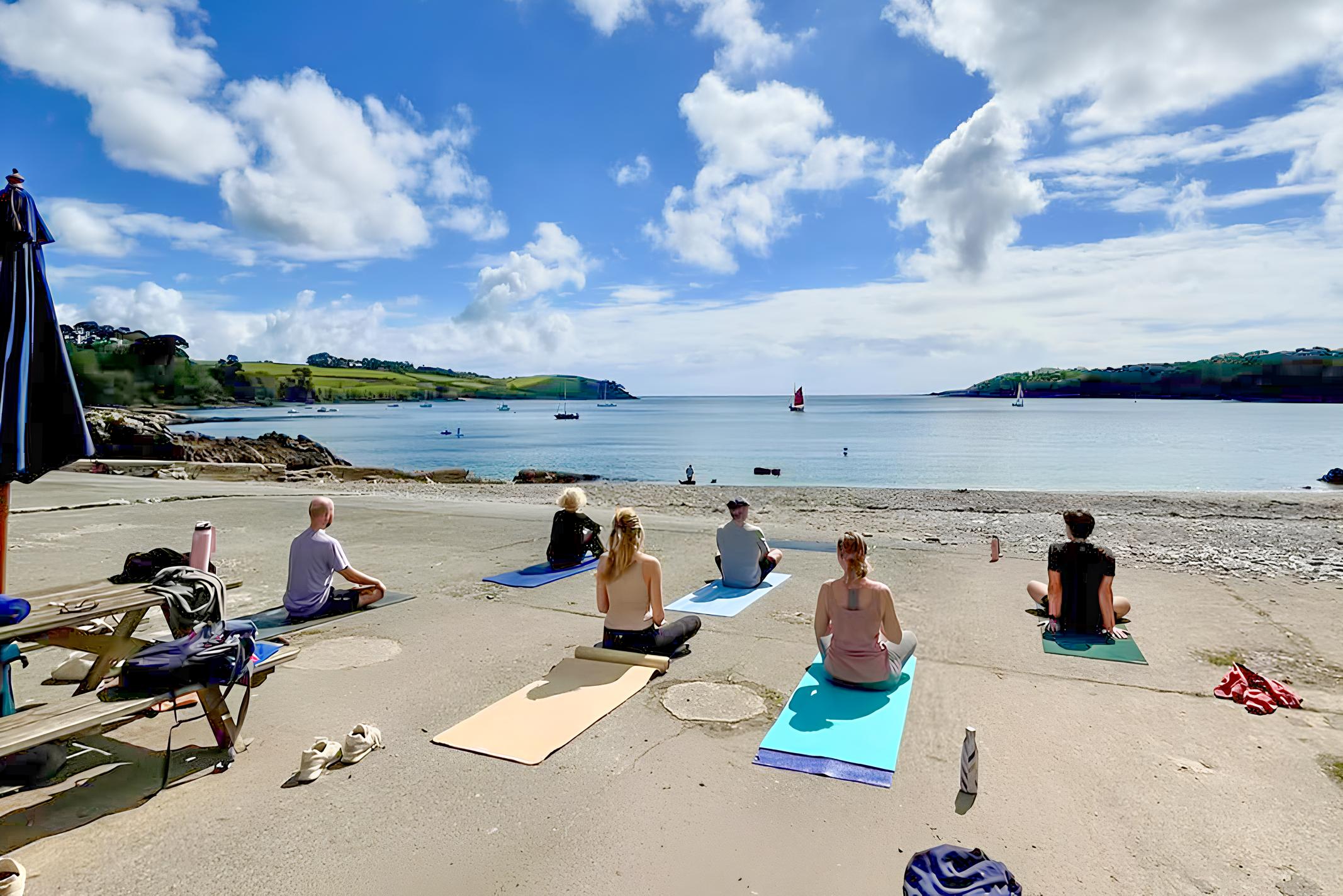 Beach yoga session at Trebah Beach