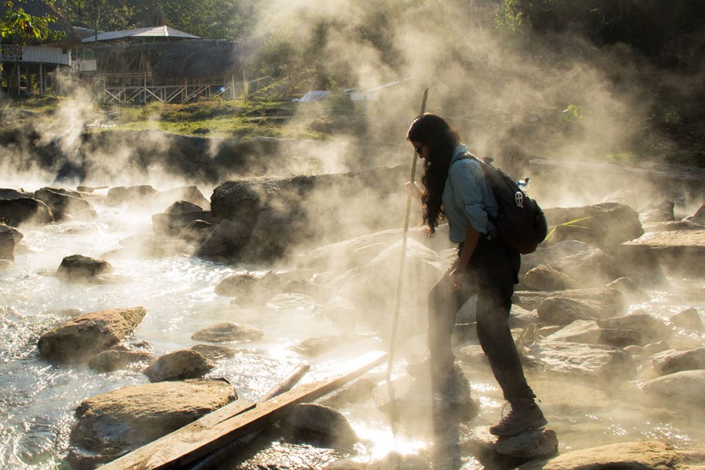 Dr. Rosa Vásquez Espinoza walking across a boiling river