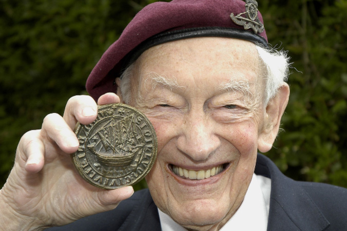 Tony Hibbert holding war medal