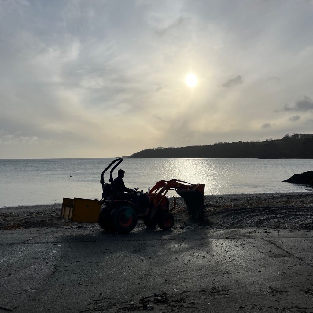 Garden driving a tractor on trebah beach