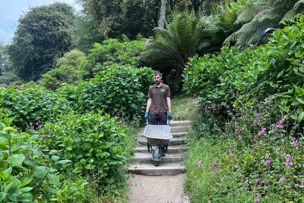 Trebah Gardener with wheelbarrow