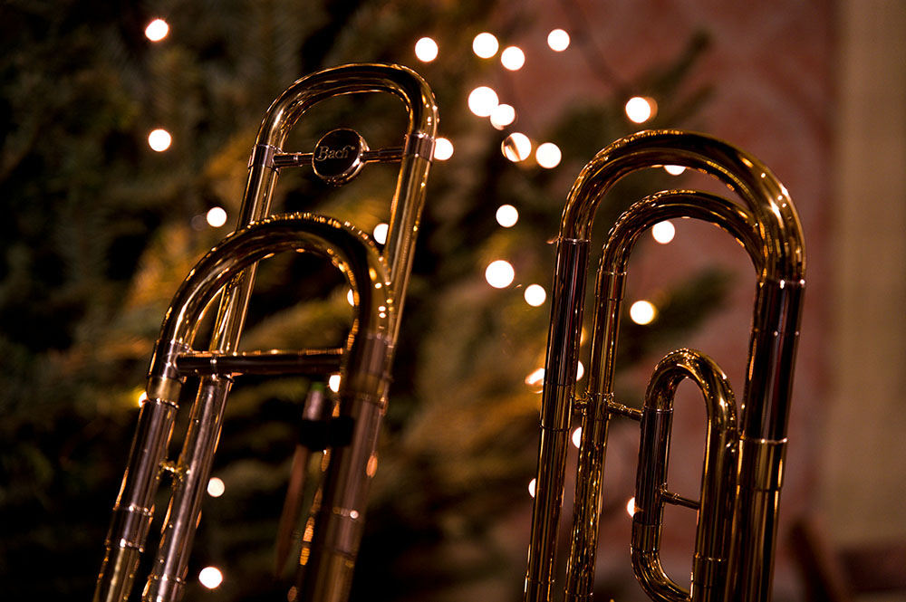Trombones against Christmas fairy light
